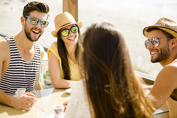 Image showing Friends at the beach bar