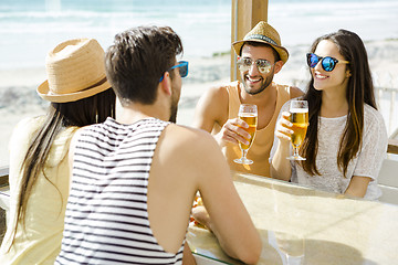 Image showing Friends at the beach bar