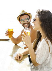 Image showing Friends drinking a cold beer