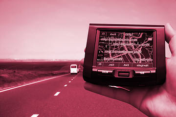 Image showing GPS Vehicle navigation system in a man hand.