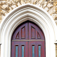 Image showing brown wooden parliament in london old  door and marble antique  