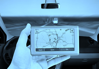 Image showing GPS Vehicle navigation system in a man hand.