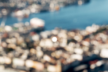 Image showing Defocused view of Bergen city with sun reflection in window