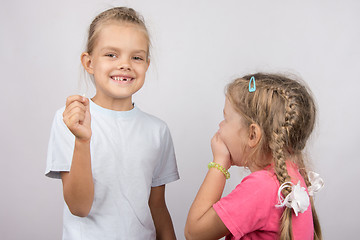 Image showing Six year old girl showing her teeth her younger sister