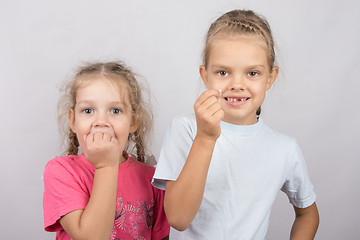 Image showing Six year old girl showing her teeth, four-year girl afraid of toothache