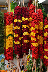 Image showing Flower garlands and basket of flower used for hinduism religion 