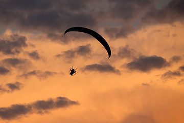 Image showing unidentified skydiver, parachutist on dramatic sky