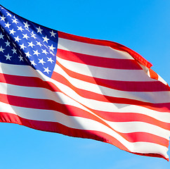 Image showing usa waving flag in the blue sky bcolour and wave