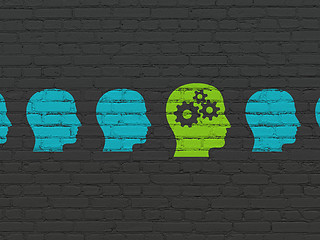 Image showing Finance concept: head with gears icon on wall background