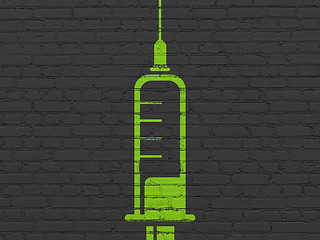 Image showing Medicine concept: Syringe on wall background