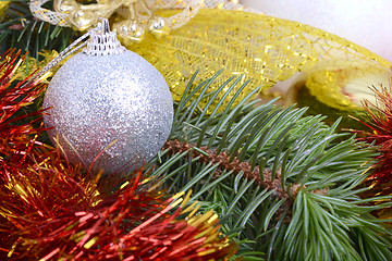 Image showing Closeup of Christmas balls and green fir tree branch, new year invitation card