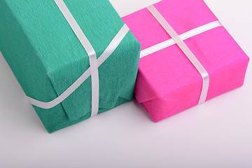 Image showing gift box set with white ribbon on white background