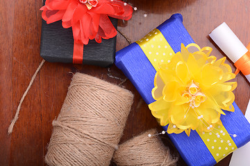 Image showing color gift boxes on wooden background