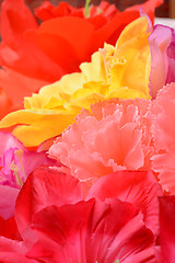 Image showing artificial flowers red handmade velor tissue background close up