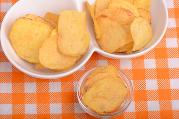 Image showing chips and peeled potato on a white plate