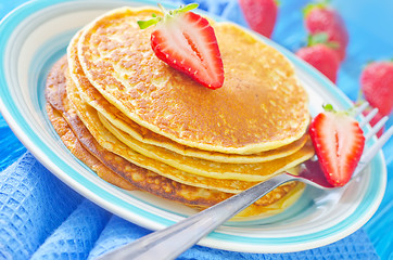 Image showing pancakes on plate and fresh strawberries