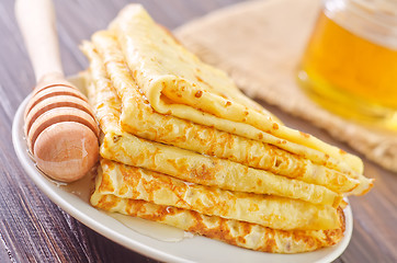 Image showing pancakes with honey