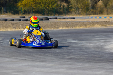 Image showing Karting - driver in helmet on kart circuit