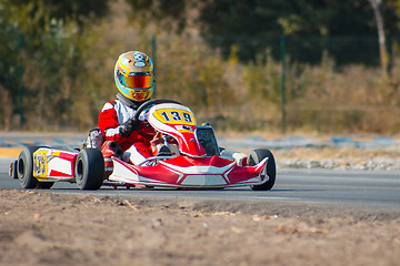 Image showing Karting - driver in helmet on kart circuit