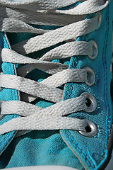 Image showing Turquoise sneaker with sholace