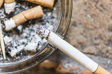 Image showing Cigarettes on ashtray