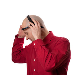 Image showing Young man puts on head headset EEG (electroencephalography)