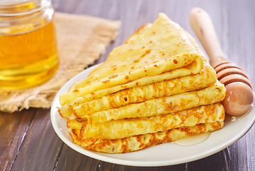 Image showing pancakes with honey