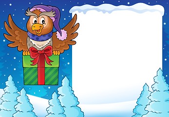 Image showing Snowy frame with owl and gift