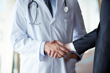 Image showing doctor handshake with a patient