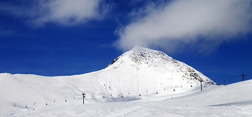 Image showing Panoramic view on ski slope at sun wind day