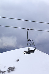 Image showing Chair lift at gray evening