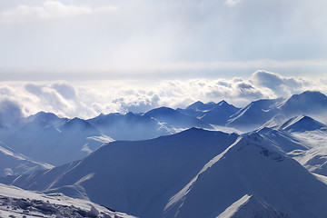 Image showing Silhouette of evening sunlight mountains in mist