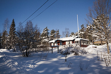 Image showing red cottage in snow