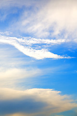 Image showing in the blue sky white soft clouds and abstract background