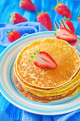 Image showing pancakes on plate and fresh strawberries