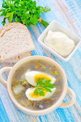 Image showing green soup with boiled eggs
