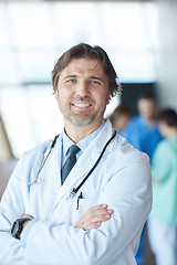 Image showing group of medical staff at hospital, handsome doctor in front of 