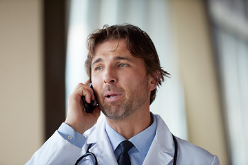 Image showing doctor speaking on cellphone