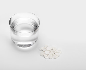 Image showing tablets and pills and glass of water