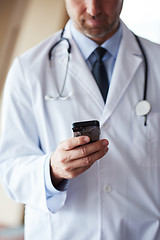 Image showing doctor speaking on cellphone