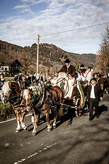 Image showing Schliersee, Germany, Bavaria,  November 08, 2015: horse-drawn carriage with altar boys in Schliersee in Leonhardifahrt