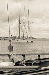 Image showing Old sailboat in the harbor, sepia