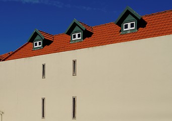 Image showing A house with red tile roof and three garrets