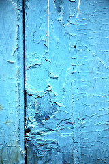 Image showing dirty stripped paint in the   wood door and rusty  