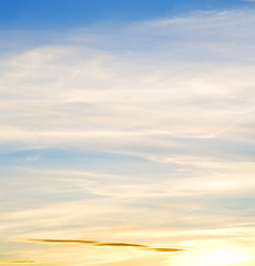 Image showing sunrise in the colored sky white soft clouds and abstract backgr