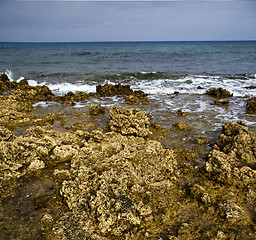 Image showing  water  in lanzarote  isle foam  stone sky cloud beach  