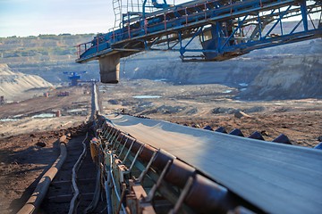 Image showing Long conveyor belt transporting ore