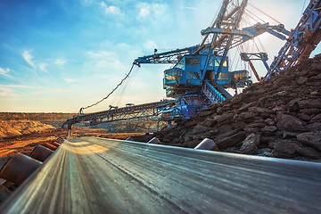 Image showing Long conveyor belt transporting ore