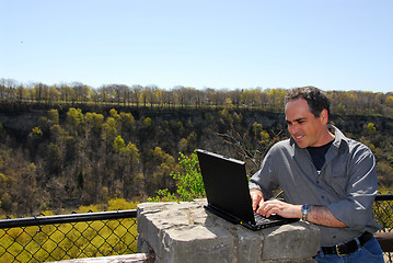 Image showing Smiling man working outdoors