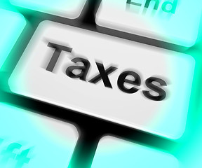 Image showing Taxes Keyboard Shows  Tax Or Taxation